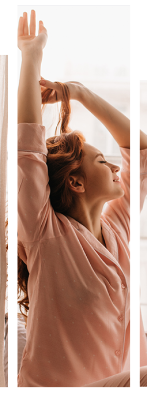 imagem de uma jovem moça se espreguiçando na cama enquanto sorri.